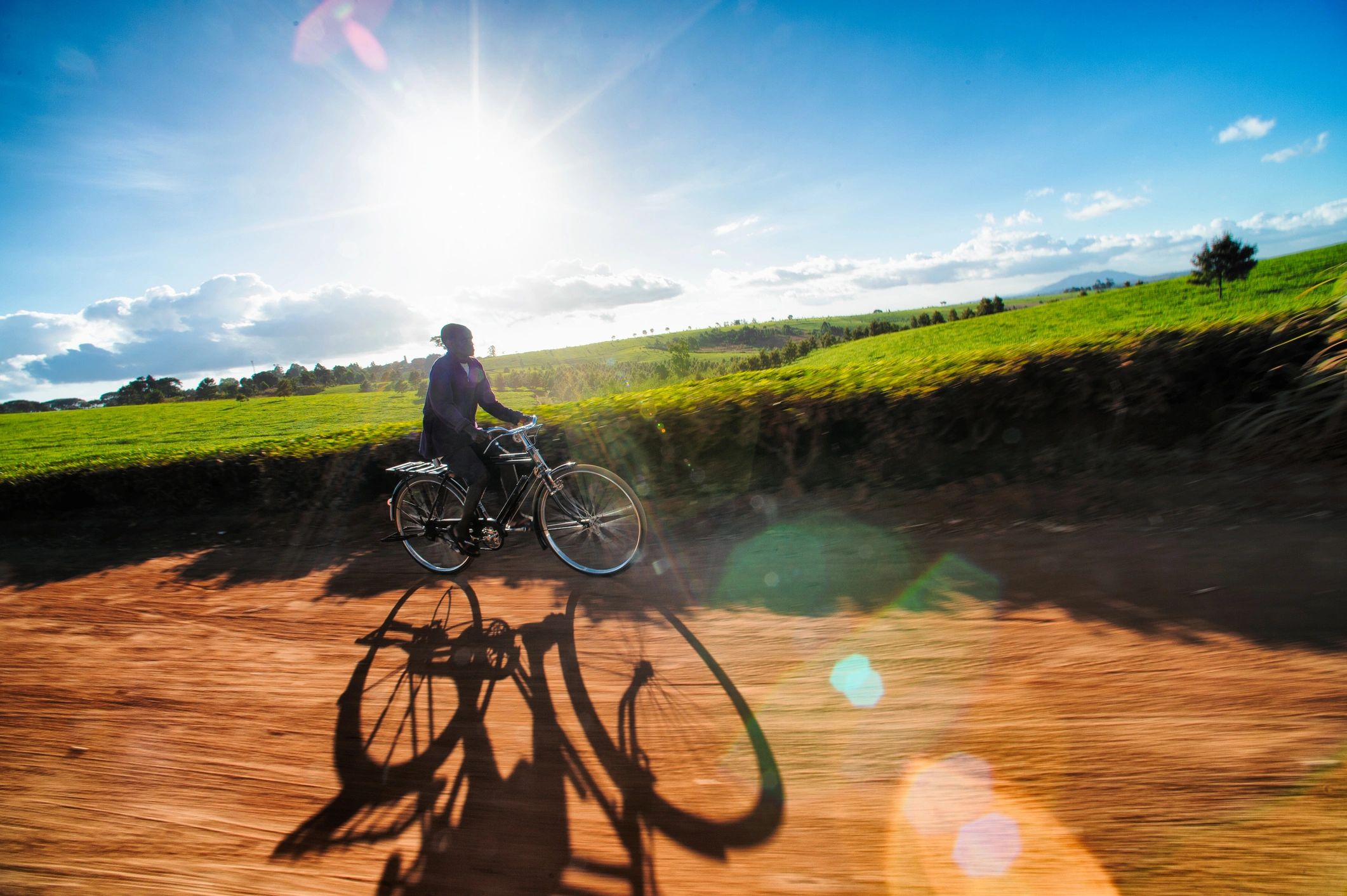Cyclist riding on a dirt road