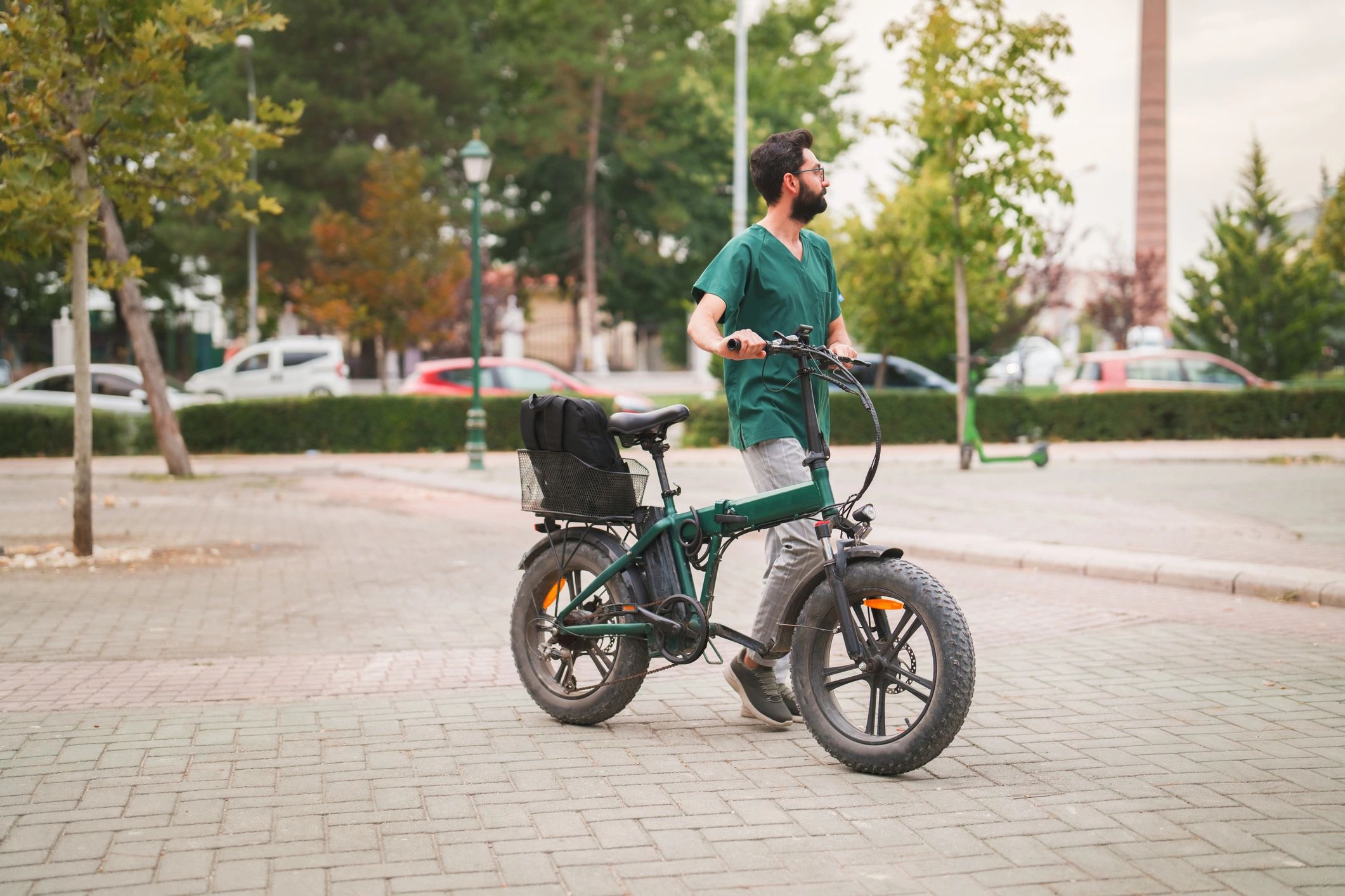 Person with an electric bike after work